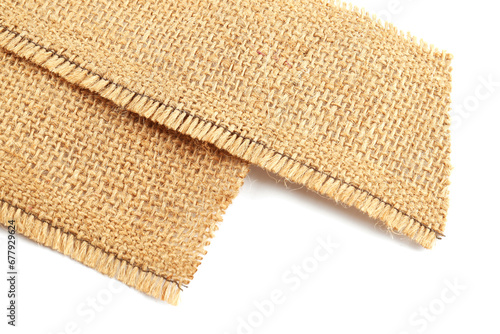 Pieces of burlap fabric isolated on white