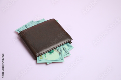 Wallpaper Mural Stylish brown leather wallet with dollar banknotes on light background. Space for text Torontodigital.ca