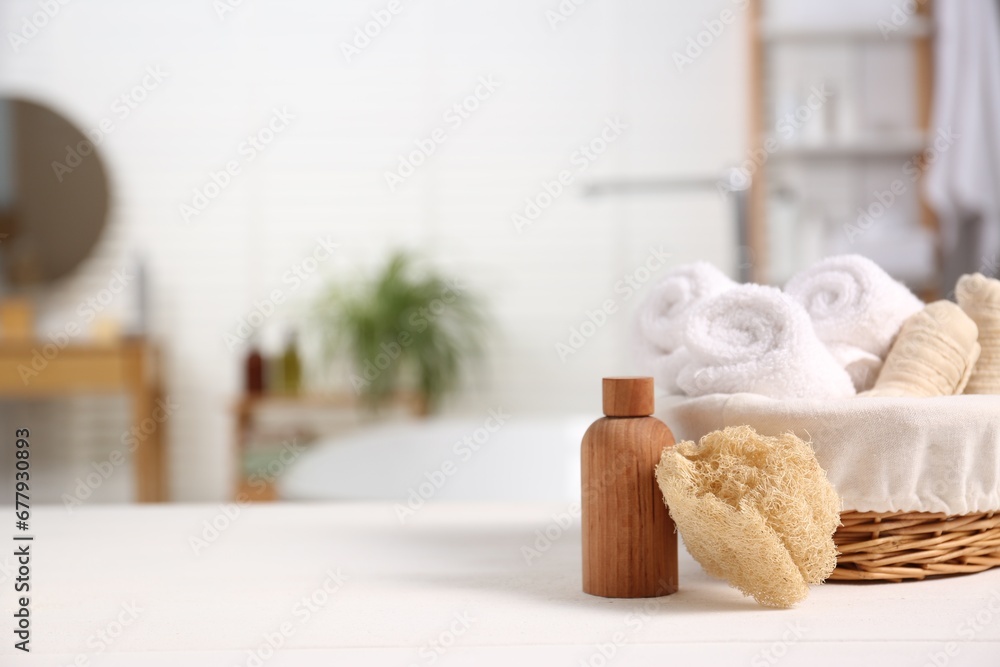 Composition with spa cosmetic product on white table in bathroom, space for text