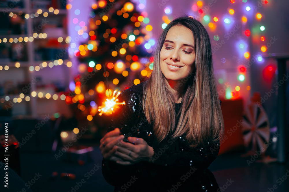 Festive Woman with fireworks Celebrating Christmas at Home. Cheerful adult person enjoying a bright holiday
Festive Woman with fireworks Celebrating Christmas at Home. Cheerful adult person enjoying a bright holiday