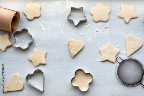 Top view of cooking a gingerbread cookie in the form of heart, star, cloud and flower. Christmas and New Year concept, festive preparations for winter hilodays.