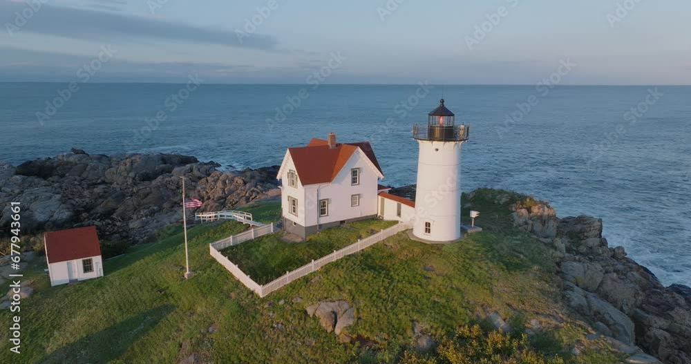 Aerial Drone shot of York Beach Maine flying around Cape Neddick Nubble Lighthouse at Sunset Aerial Drone shot of York Beach Maine flying around Cape Neddick Nubble Lighthouse at Sunset