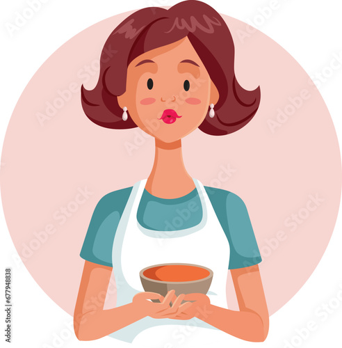 Happy Woman Holding a Homemade Bowl of Soup Vector Illustration. Home cook serving a delicious dish for lunch 
