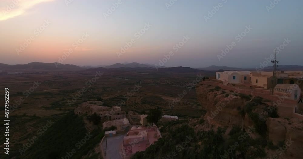 Aerial Backward Shot Of People On Cliff In Tranquil Desert - Mahdia, Tunisia Aerial Backward Shot Of People On Cliff In Tranquil Desert - Mahdia, Tunisia