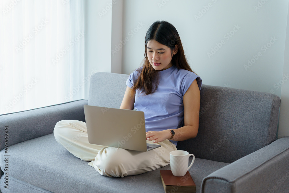 Happy beautiful Asian Woman. Business woman working from home with laptop Financial Home work space concept. Happy beautiful Asian Woman. Business woman working from home with laptop Financial Home work space concept.