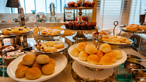 breakfast buffet in a luxury hotel in Thailand, sweets and bread on a plate