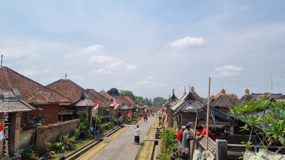 Traditional houses in Penglipuran village, Bali. Penglipuran is a traditional oldest bali village at Bangli Regency, Bali, Indonesia. The cleanest village and still upholds traditional culture. Traditional houses in Penglipuran village, Bali. Penglipuran is a traditional oldest bali village at Bangli Regency, Bali, Indonesia. The cleanest village and still upholds traditional culture.