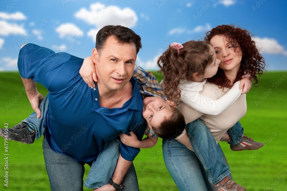 Happy family play together in the park Happy family play together in the park