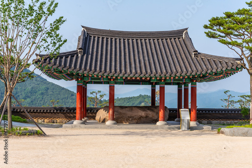 Korean traditional pavilion with large rock in it. © Robert Stedman