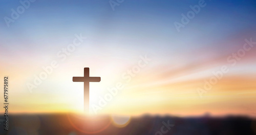 christian cross on hill outdoors at sunrise photo