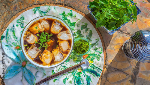 A top-down perspective of Vietnamese ca phe sua da captures the strong and sweet iced coffee, a popular and energizing beverage enjoyed in the bustling streets of Vietnam. photo