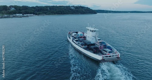 Aerial Drone shot of Ferry approaching Shelter Island North Fork Long Island New York before sunrise photo