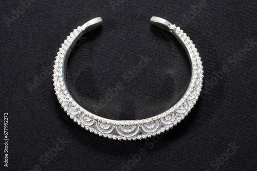 Hmong silver jewelry on black background, Handmade silver accessories photo