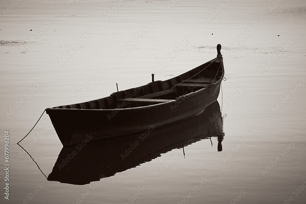 sunrise with boats on the lake