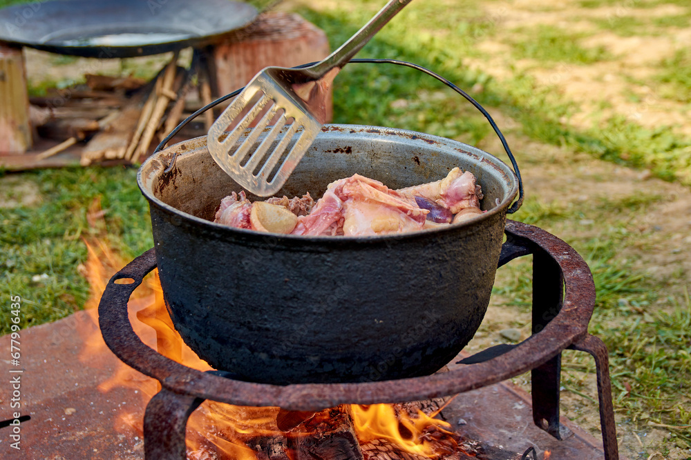 pork prepared in a cauldron