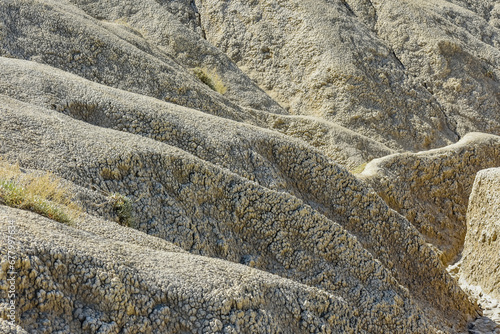 Obraz na płótnie cones of mud volcanoes from which rivers of mud flow w salonie