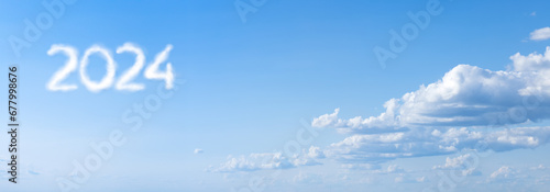 2024 New Year Concept: Clouds Forming the Year number in a Clear Blue Sky