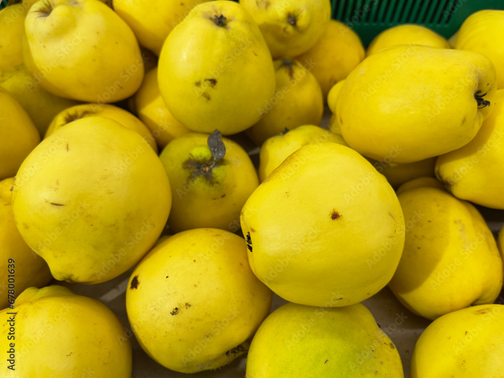 Fresh quince fruit in the market, closeup of photo.