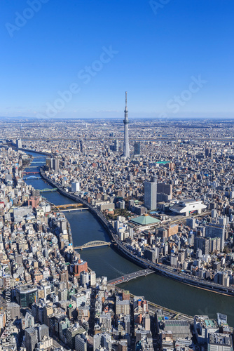 Bridges in various colors across Sumida River and Sky Tree seen from the sky above Chuo Ward , Japan,Tokyo December 2013 photo