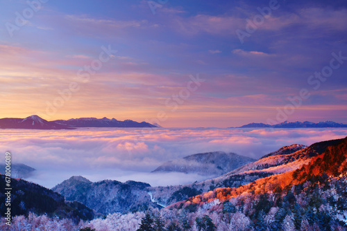 The Yatsugatake mountain range, Mt. Fuji, the sea of clouds, and the foggy ice forest in the morning seen from Utsukushigahara , Chiisagata District, Nagano,Nagawa, Nagano,Japan March 2018 photo