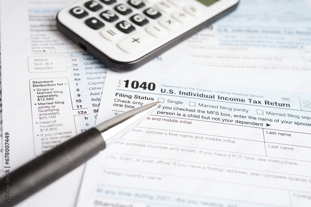 Tax form 1040 U.S. Individual Income Tax Return, business finance concept. Tax form 1040 U.S. Individual Income Tax Return, business finance concept.
