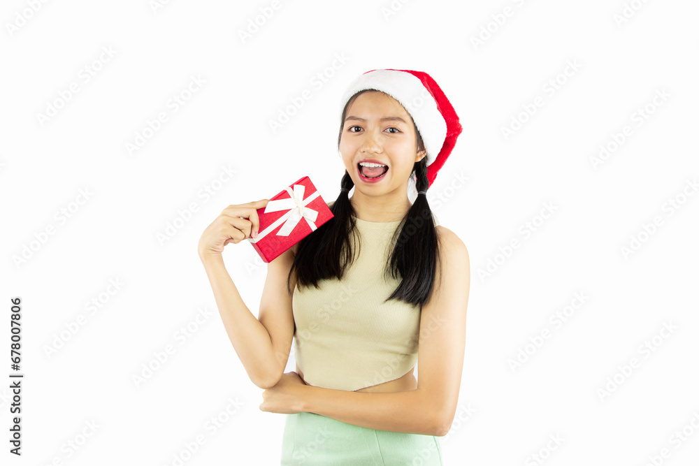 Pretty Asian Teenage Girl in santa hat with red gift box on white background, merry christmas concept. Pretty Asian Teenage Girl in santa hat with red gift box on white background, merry christmas concept.