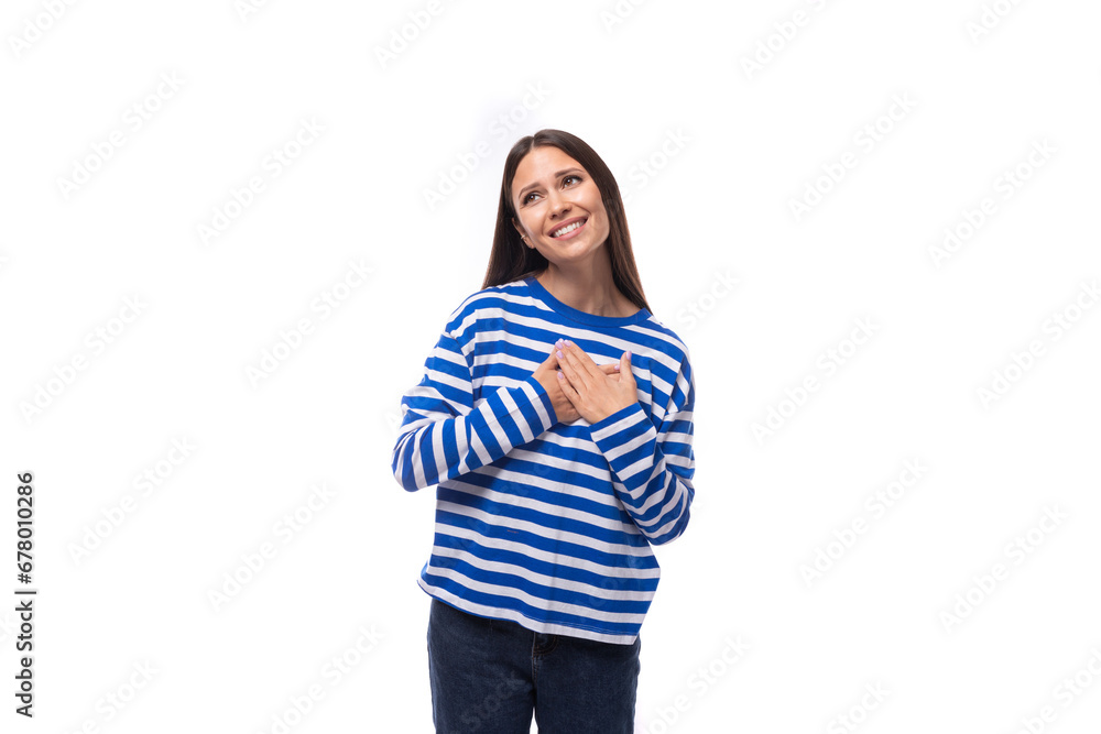 pretty young slim european model woman dressed in a blue sweater on a white background pretty young slim european model woman dressed in a blue sweater on a white background