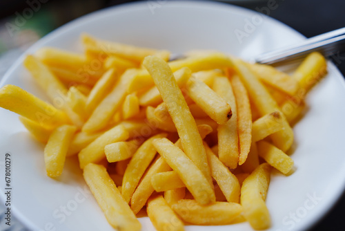 A plate of french fries. favorite fast food food.