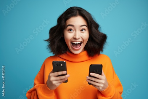 happy asian woman with smartphone face excited