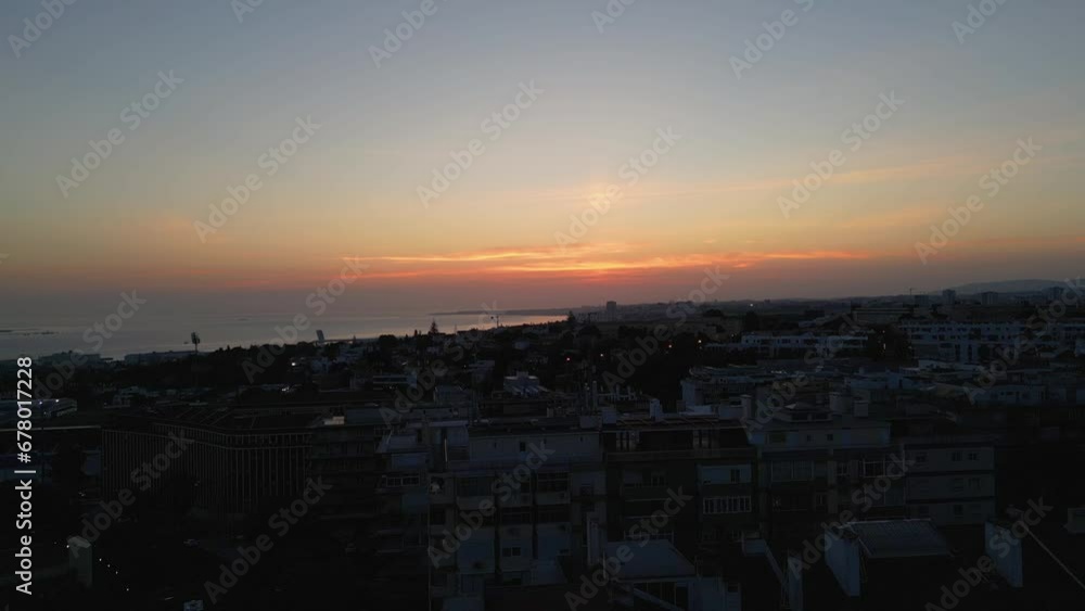 Up down aerial view of the beautiful sunset and ocean view, overview cityscape of Lisbon. Up down aerial view of the beautiful sunset and ocean view, overview cityscape of Lisbon.