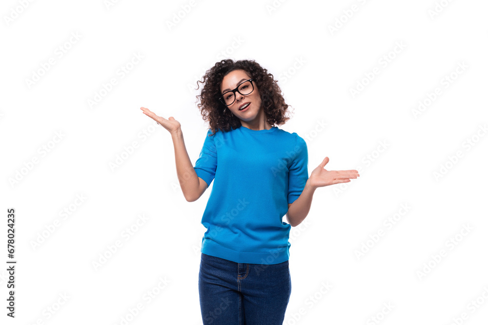 confident successful young caucasian woman with curls dressed in a blue t-shirt confident successful young caucasian woman with curls dressed in a blue t-shirt