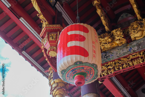 Traditional handcrafted Chinese Fui Chew lantern on top of an ancestral hall in George Town City, Penang, Malaysia.
