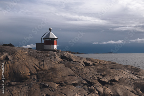 lighthouse on a rocky beach