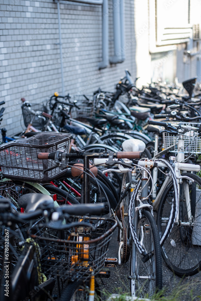 Bicycle parking lots near the building wall in Tokyo