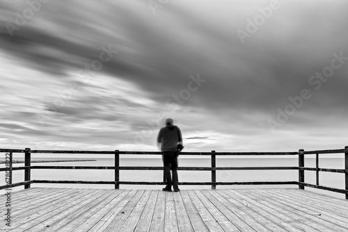Middle-aged man enjoying himself on the Santa Pola pier photo