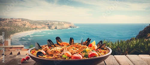 Fresh homemade seafood paella ready on the terrace Copy space image Place for adding text or design