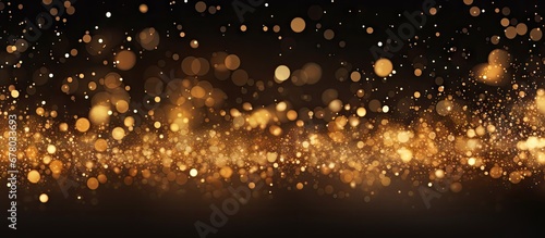 Festive background with golden particles on dark surface Abstract holiday backdrop Copy space image Place for adding text or design