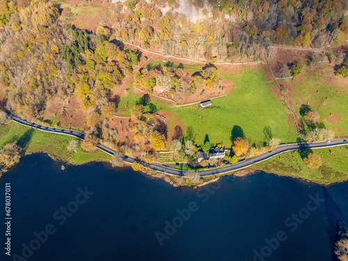 Aerial image of Rydal water lake in the lake district national park and the lake side road , United kingdom on a beautiful autumn day.  © bardhok