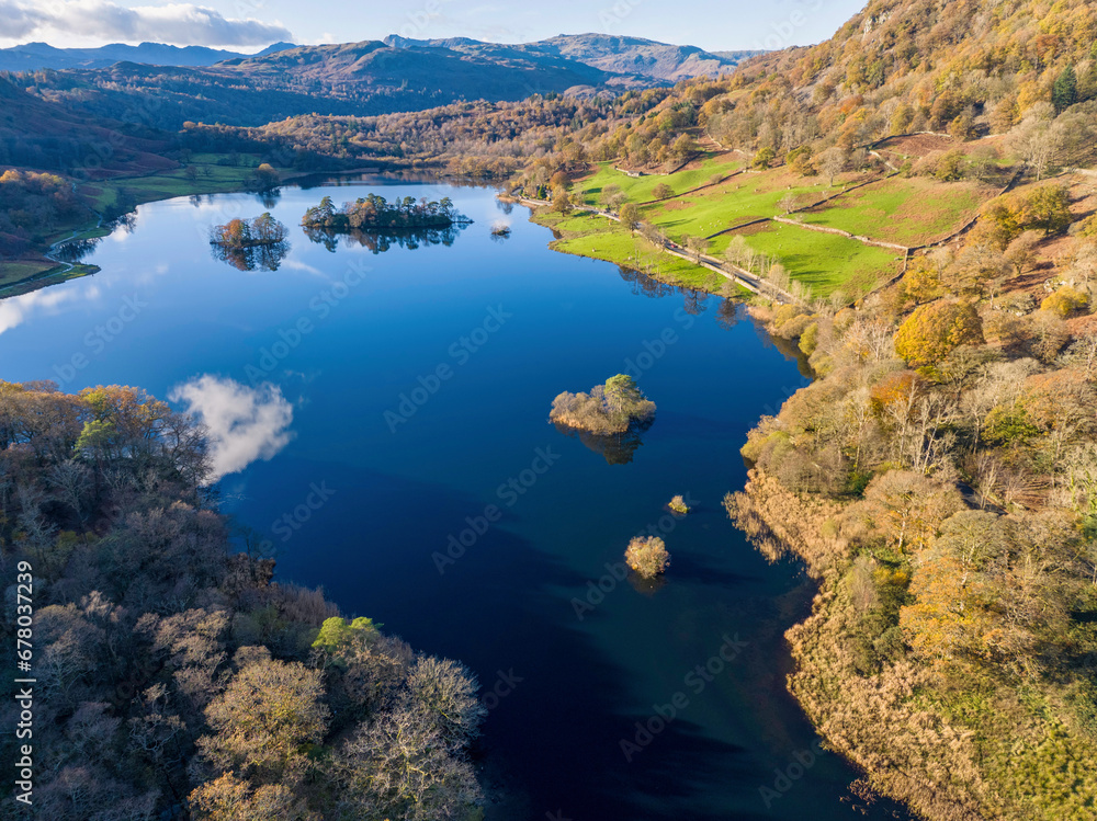 Fototapeta premium Aerial image of Rydal water lake in the lake district national park, United kingdom on a beautiful autumn day. 