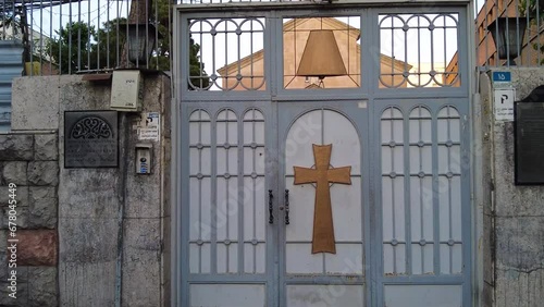 Christian catholic church in Iran Tehran down town old city historical street of 30 tir in middle east Asia in sunset time early morning in a cobble stone walkway  visit tourist attraction scenic view photo