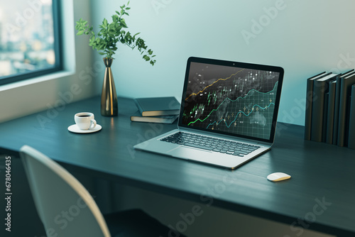 Close up of office workplace with laptop computer with glowing candlestick forex chart on screen, coffee cup and other items. Stock market, trading analysis and investment concept. 3D Rendering.