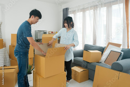 Asian young happy new married couple moving to their new house or real estate. © ijeab