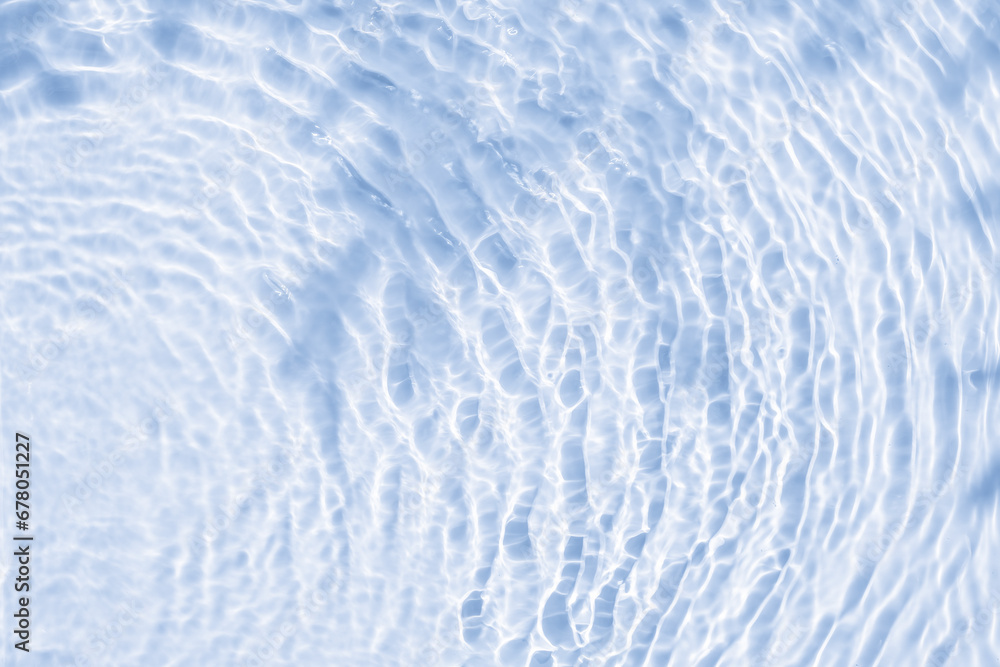 Obraz premium Background summer natural blue texture, clear water with ripples and splashes. Water waves in sunlight with leaf shadow, and background concept of cosmetics, moisturizer, and toner.