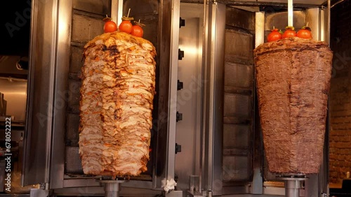 Meat on spit for Shawarma. Meat on grill. Cooking. Doner Traditional Turkish Meat Doner Kebab. Shawarma or gyroscopes. Greek or Middle Eastern Arabic Style Chicken Doner Kebab Food photo