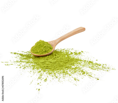 Green matcha powder in a spoon isolated on white bcakground photo