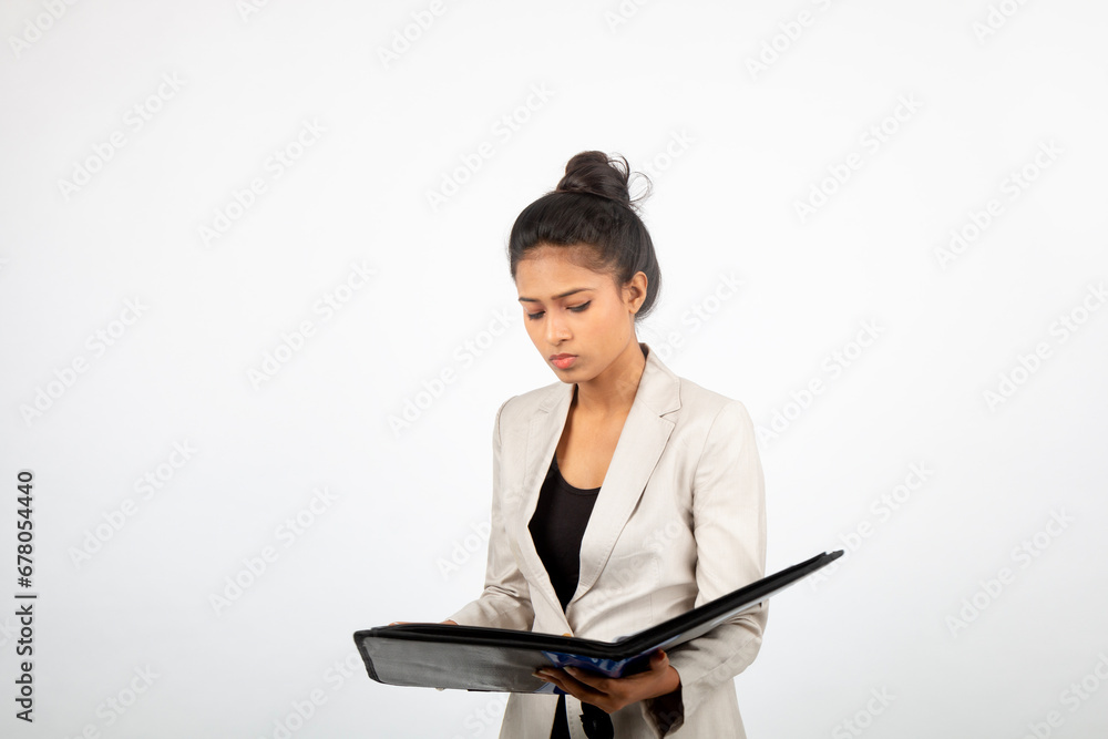 Corporate office lady holding a folder and giving presentation. Young woman in formal wear wearing white blazer giving different expressions with a floder in her hand Corporate office lady holding a folder and giving presentation. Young woman in formal wear wearing white blazer giving different expressions with a floder in her hand