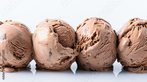 Scoops of chocolate ice cream on white background