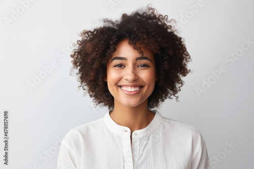 Portrait of a cheerful young black woman with curly hair photo