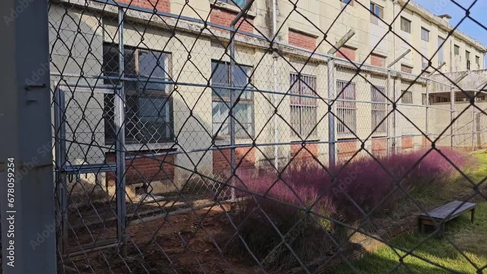 Walking Along Prison Barbed Wire Fence and Iksan Korean Drama Set Jail Building Facade Walking Along Prison Barbed Wire Fence and Iksan Korean Drama Set Jail Building Facade