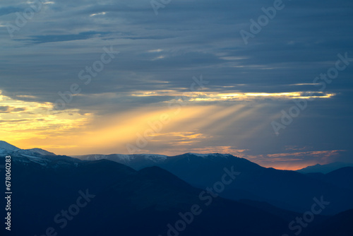 Rays of sunlight reflected from the clouds to the mountains.Rays of sunlight reflected from the clouds to the mountains. Sunset Colorful images in the mountains. View of Kackar mountains from Huser P © osman